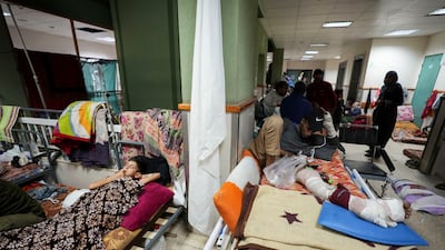 Palestinians injured in Israeli strikes lie on beds at Al Aqsa Martyrs' Hospital in Deir Al Balah. Reuters