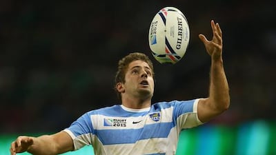 Santiago Cordero of Argentina leaps high to keep the ball in play. Michael Steele / Getty Images