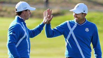 Europe’s Sergio Garcia, left, and Rory McIlroy celebrate after sinking a 10-foot putt on the eighth hole during their foursomes match against Rickie Fowler and Jimmy Walker of the United States on the first day of the Ryder Cup at Gleneagles, in Perthshire, Scotland. Europe lead 5-3. Andy Rain / EPA