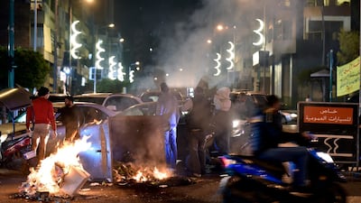 Supporters of outgoing Lebanese Prime Minister Hariri burn dumpsters and woods as they block the main highway to protest against the nomination of Hassan Diab as prime minister. EPA