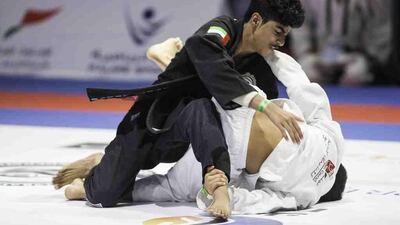 Ahmed Al Maazmi of the Sharjah Jiu Jitsu club, left, fights Ahmed Yaser Al Harmi of the UAE teen team during their 50kg juvenile white belt bout at the Abu Dhabi World Jiu Jitsu Festival at the Ipic Arena in Abu Dhabi on April 13, 2017. Christopher Pike / The National