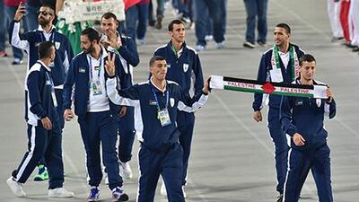 Palestinian Territories athletes walk in their delegation parade during the opening ceremony of the 2014 Asian Games at the Incheon Asiad Main Stadium in Incheon. Jung Yeon-je / AFP