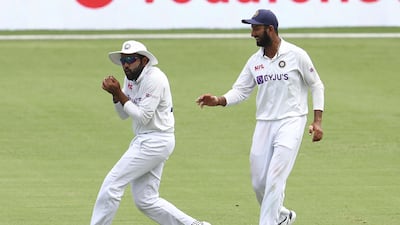 India fielder Rohit Sharma takes a catch to dismiss Australia's Cameron Green. AP