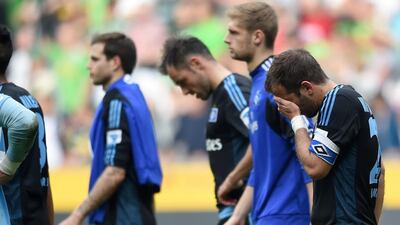 Hamburg players leave the field after the match against Borussia Moenchengladbach on March 30, 2014. AFP