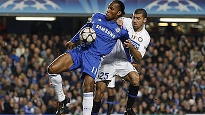 Chelsea's Didier Drogba, left, competes with Inter Milan's Walter Samuel in their Champions League match at Stamford Bridge.