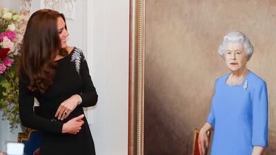 Catherine, Duchess of Cambridge inspects a portrait of Queen Elizabeth painted by New Zealand artist Nick Cuthell and unveiled during a state reception in Wellington, in 2014. Getty Images