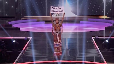 Miss Myanmar Thuzar Wint Lwin holds up a 'Pray for Myanmar' sign during Miss Universe pageant's national costume show, in Hollywood, Florida, US. Lwin won the Best National Costume. Reuters