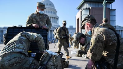 National Guard members deploy on US Capitol grounds in Washington, DC. Reuters