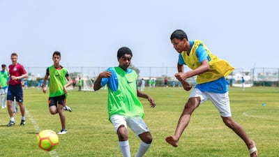 Rising Stars practicing at the Al Dafra Football Club Al Mirfa Branch. Victor Besa / The National.