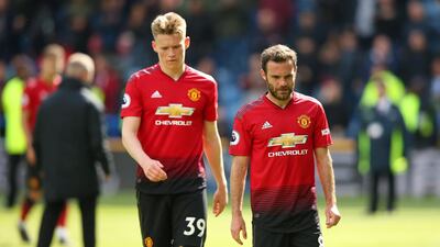 Juan Mata, right, and Scott McTominay express their dejection at Manchester United's failure to beat Huddersfield Town. Getty