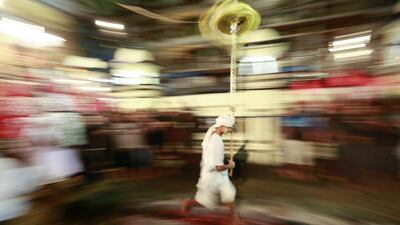 A picture taken with a slow shutter speed shows a Myanmar Shiite Muslim devotee running barefoot over a bed of burning coals as he takes part in the Muharram processions ahead of the Islamic commemoration of Ashura, in Yangon, Myanmar. Lynn Bo Bo / EPA