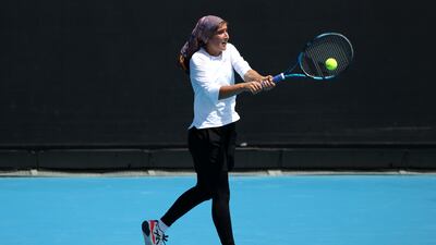 Meshkatolzahra Safi hits a backhand to Anja Nayar. Getty Images
