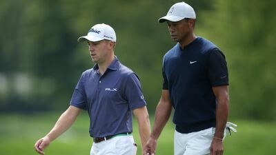 Justin Thomas, left, and Tiger Woods walk down the 12th fairway during the first round of the US Open at Winged Foot Golf Club. Reuters