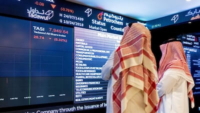 Visitors look at stock price information displayed on a digital screen inside the Saudi Stock Exchange (Tadawul). Riyadh-based Alkhorayef Water & Power Technologies was listed on the Saudi Stock Exchange earlier this year. Bloomberg