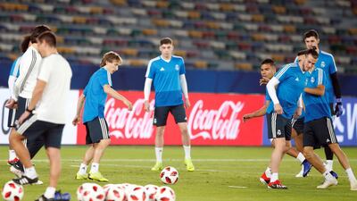 epa07238698 Real Madrid's Luka Modric (C-L) and Gareth Bale (2-R) attend a training session at Zayed Sports City stadium in Abu Dhabi during the FIFA Club World Cup 2018, United Arab Emirates, 18 December 2018. The three times winner of FIFA Club World Cup Real Madrid will face Asian Champions League winner Kashima Antlers in their semifinal soccer match on 19 December 2018. EPA/ALI HAIDER