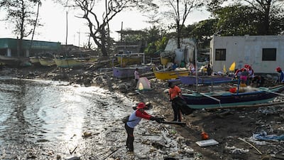 Volunteers clear up after an oil spill in the Philippines. Scientists say billions of people around the world lack access to uncontaminated water. AFP