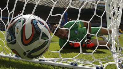 Greece keeper Orestis Karnezis watches as the ball goes into the net as a goal is scored by Colombia's Pablo Armero (unseen) during their 2014 World Cup Group C match on Saturday in Belo Horizonte, Brazil. Paulo Whitaker / Reuters