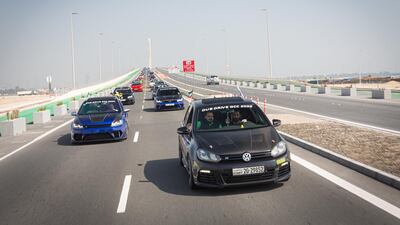 The convoy heads down from Al Hudariyat Bridge.