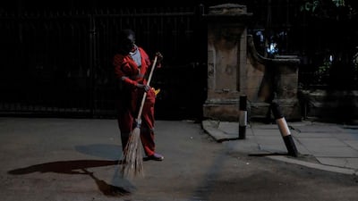 Lillian sweeping the empty streets of the CBD in Nairobi. AFP