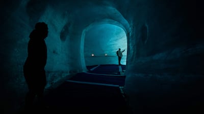 Tourists visit the Mer de Glace ice cave in the Mont Blanc massif of the French Alps. AFP