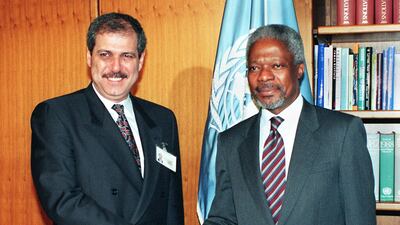 Fayez Tarawneh (L) shakes hands with then-UN secretary general Kofi Annan before the 52nd session of the UN General Assembly in New York in 1997. AFP