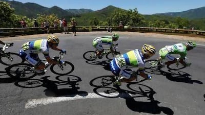 The pack of riders cycles its way past a curve on the seventh stage. Jean-Paul Pelissier / Reuters