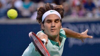 Roger Federer even had chance to show off his trademark between-the-legs shot in a second-set rally that ended with him blazing the ball wildly into the crowd. Nathan Denette / AP