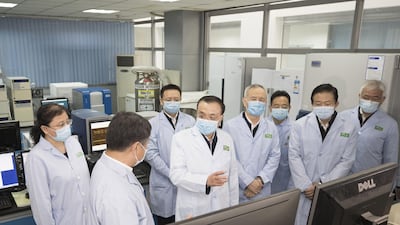 A picture released by Xinhua News Agency shows Chinese Premier Li Keqiang (C), also a member of the Standing Committee of the Political Bureau of the Communist Party of China (CPC) Central Committee and head of the leading group of the CPC Central Committee on the prevention and control of the epidemic, inspecting the Institute of Pathogen Biology at the Chinese Academy of Medical Sciences in Beijing, China. EPA
