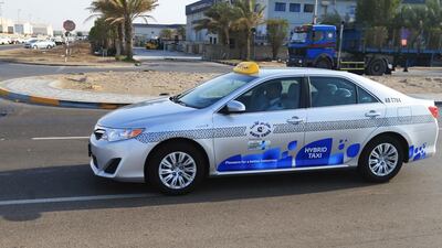 A hybrid taxi on the road in Abu Dhabi. Ravindranath K / The National