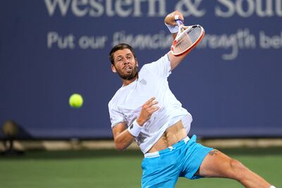 Cameron Norrie hits an overhead to Ben Shelton. AP Photo
