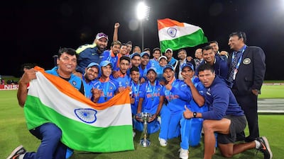 Rahul Dravid, head in front of the Indian flag at the back, is inconspicuous in this photo. That is how he likes it. Marty Melville / AFP