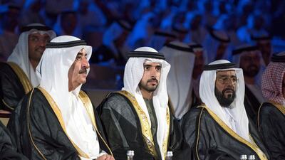 Left to right, Sheikh Saud bin Rashid Al Mu'alla, UAE Supreme Council Member and Ruler of Umm Al Quwain, Sheikh Hamdan bin Mohammed Al Maktoum, Crown Prince of Dubai and Sheikh Tahnoon bin Mohammed Al Nahyan, Ruler's Representative in the Al Ain Region, watch a show titled “This Is The Future”, during the 46th UAE National Day celebrations at Mushrif Palace. Mohamed Al Hammadi / Crown Prince Court - Abu Dhabi