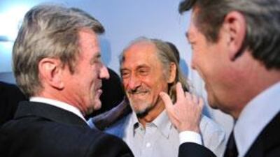 The French hostage Pierre Camatte, centre, was greeted by the French foreign and European affairs minister, Bernard Kouchner, left, and the French junior minister for foreign aid and Francophony Alain Joyandet.
