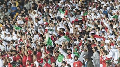 UAE fans cheer on their team at Zayed Sports City stadium during the match against India at the 2019 Asian Cup. All photos by Antonie Robertson / The National