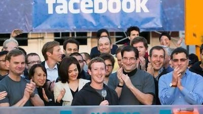 Mark Zuckerberg, centre, rings the Nasdaq opening bell from his Facebook headquarters in Menlo Park, California. AP Photo