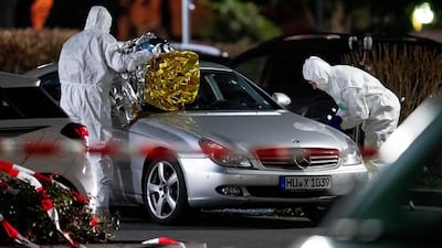 Police forensic officers investigate at the scene after a shooting in central Hanau, Germany. several people were killed in shootings in the German city of Hanau on Wednesday evening, authorities said. AP Photo