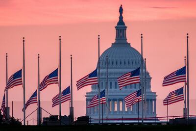 Flags fly at half-mast at the US Capitol to mark John McCain's death. AP Photo