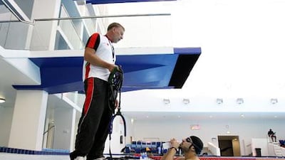 Jay Benner, the UAE coach, passes on instructions to one of his swimmers ahead of tomorrow’s opening leg in Dubai.