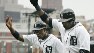 Detroit Tigers' Marcus Thames, right, celebrates his first two-run home run with teammate Curtis Granderson in the first inning of their match with the Milwaukee Brewers on Friday, which Detroit won 10-4.