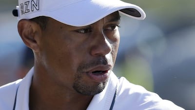 Tiger Woods loads his car after withdrawing from the first round of the Farmers Insurance Open on February 5, 2015. Gregory Bull / AP