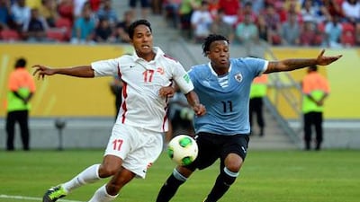 Uruguay's Abel Hernandez, right, scored a hat-trick against Tahiti as both teams were reduced to 10 men. Laurence Griffiths / Getty Images
