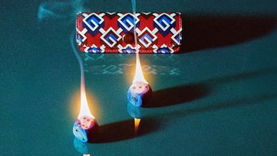 A set of dice with a colourful box.