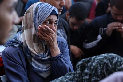 A Palestinian woman reacts in front of the bodies of people killed in an Israeli strike, at Al Aqsa Martyrs Hospital in Deir Al Balah in the central Gaza Strip, on November 17. AFP