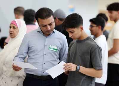 A pupil finds out his A-level grades at Gems Wellington Academy – Silicon Oasis in Dubai. Chris Whiteoak / The National