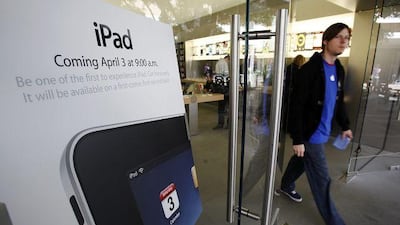 An Apple Store in Palo Alto, California, displays an iPad advertisement in its window. Many are expected to line up today to buy the new device.