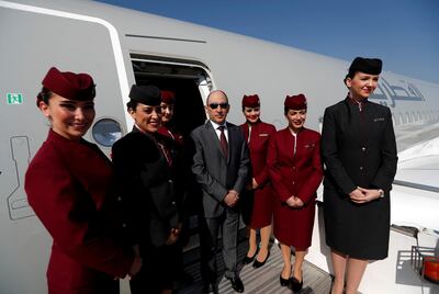 Qatar Airways CEO Akbar al-Baker poses with cabin crew outside an Airbus A350-1000 in Turkey in April. Reuters