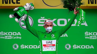 Team UAE Emirates rider Alexander Kristoff celebrates his green jersey for best sprinter. AFP