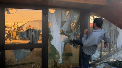 Rebel fighter brakes the glass of the Moammar Gadhafi's tent inside the main compound in Bab Al-Aziziya in Tripoli, LIbya, Tuesday, Aug. 23, 2011.Libyan rebels stormed Moammar Gadhafi's main military compound in Tripoli Tuesday after fierce fighting with ???