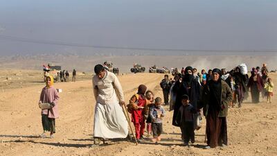 Displaced Iraqis flee their homes in western Mosul on February 25, 2017 as government forces battle with ISIL militants. Alaa Al Marjani / Reuters