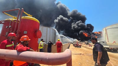 Firefighting teams attempt to extinguish a blaze at the Zawiya refinery. AFP